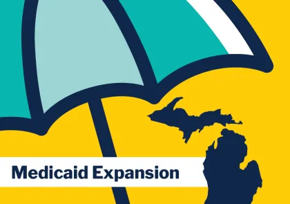 Medicaid Expansion with umbrella over the state of Michigan