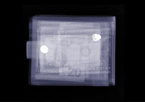 Illustration with different currencies layered like an xray