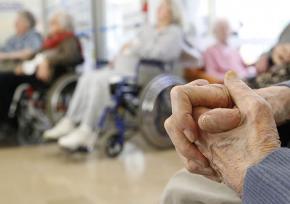 Older adults in a group, some in wheelchairs