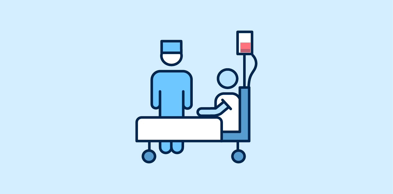 patient sitting in hospital bed with doctor by the side of bed