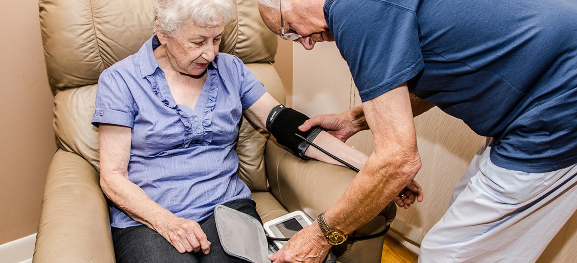 older couple checking blood pressure